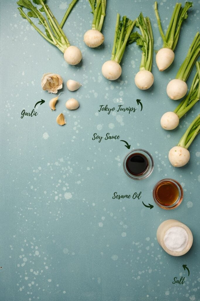 Ingredients for turnip recipe, including Tokyo turnips, garlic, sesame oil, soy sauce, and salt.