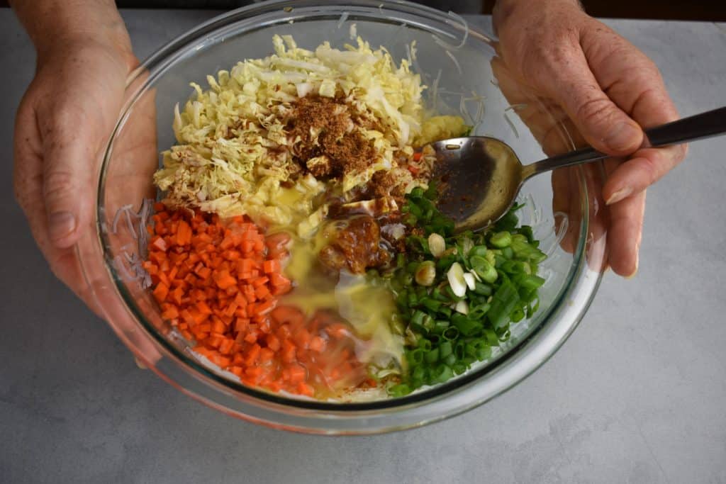 all the stuffing ingredients together in a bowl with spices and oils.