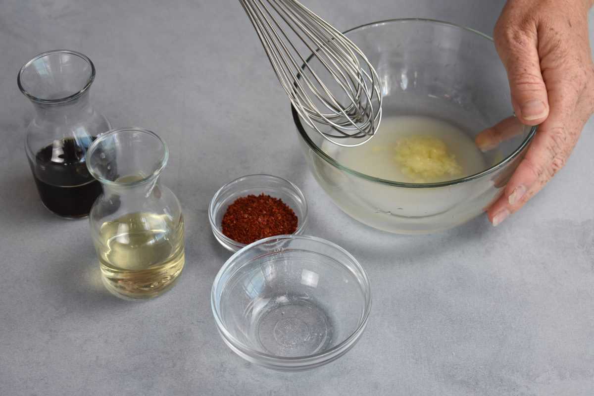 ingredients for dipping sauce being whisked together.