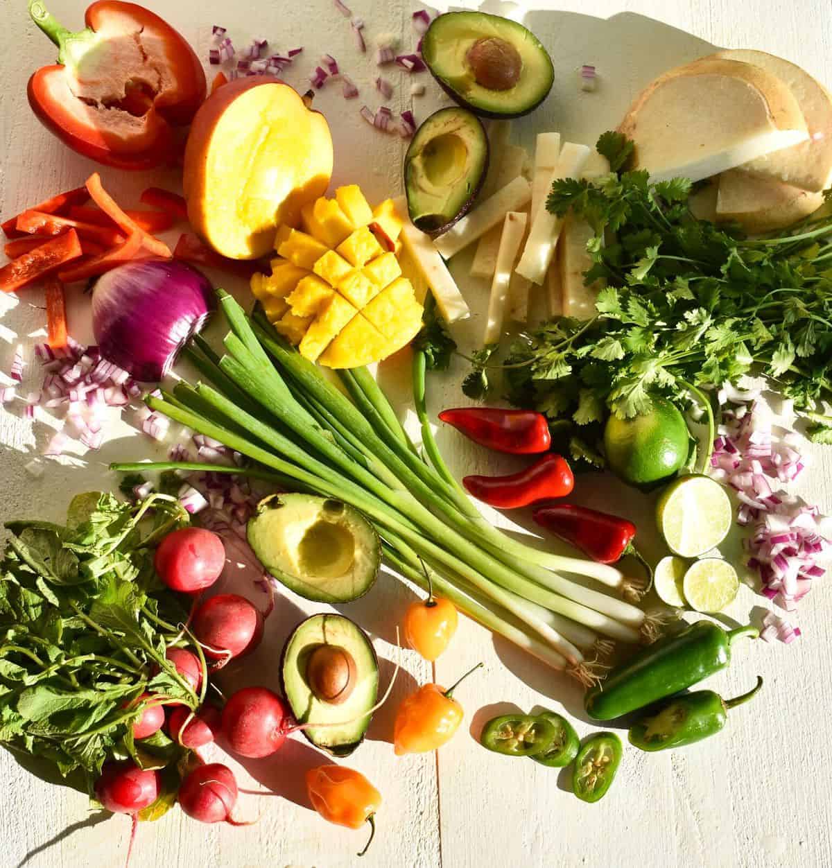 bell peppers, mango, avocado, turnip, cilantro, red onion, scallions, chilli and lime.