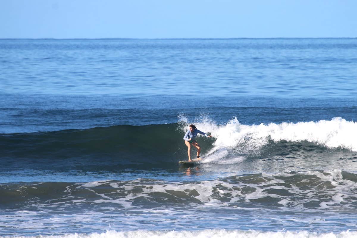 photograph of a surfer on a wave