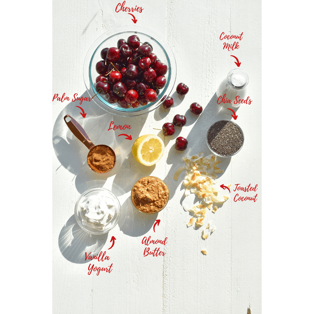 ingredients for chia pudding cups: cherries, coconut milk chia seeds, vanilla yogurt, palm sugar, lemon and toasted coconut