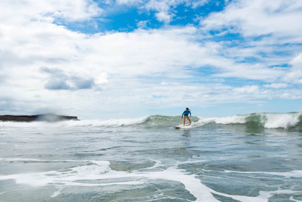 a surfer, surfing a wave