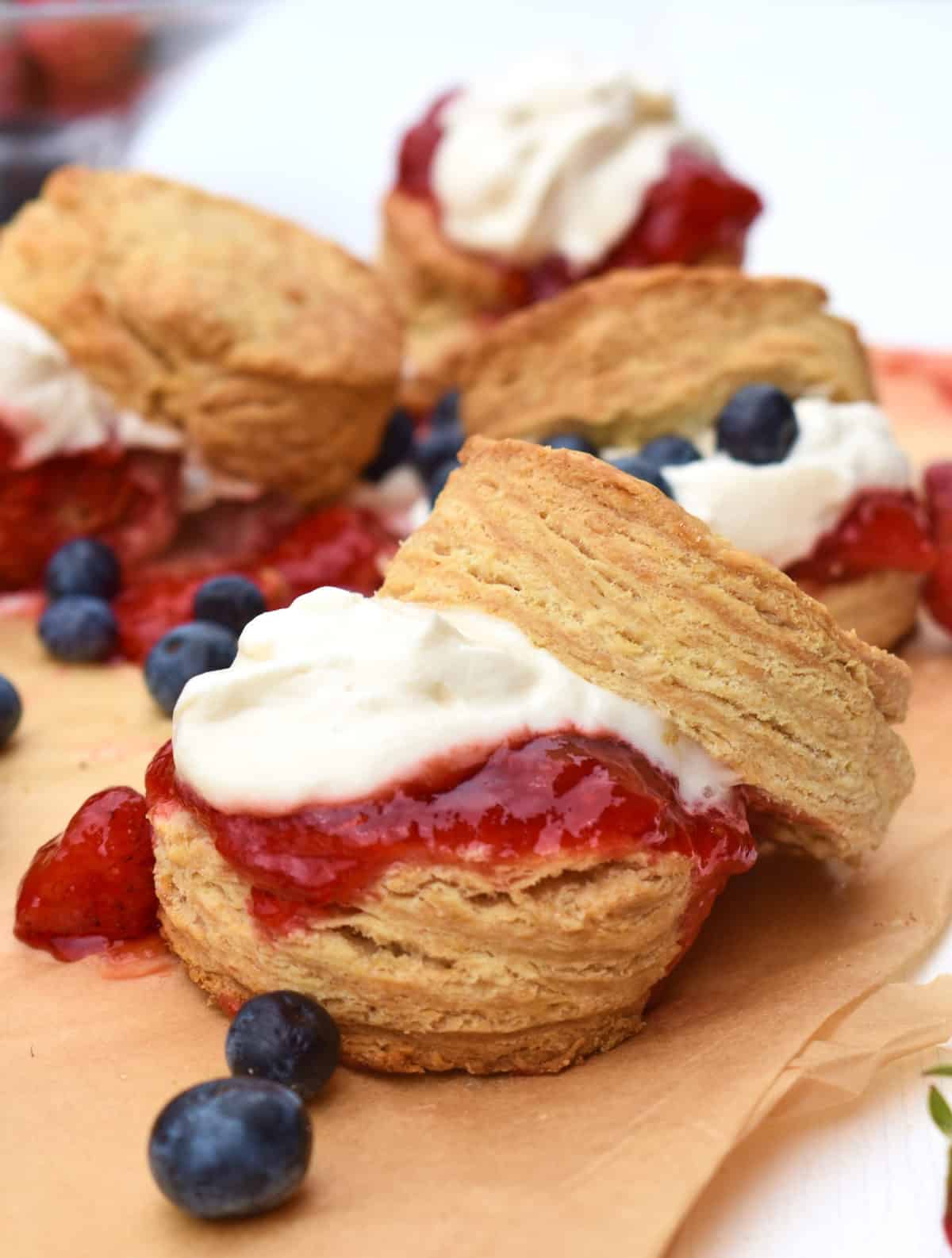 close up of maple biscuits with strawberry and cream filling