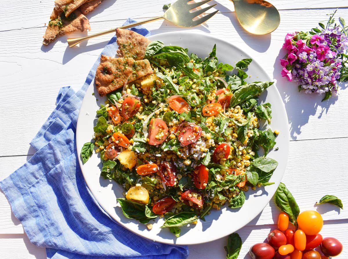 Grilled Corn, Tomato, Red Onion, Arugula, and Ricotta Salata Salad with Basil Vinaigrette