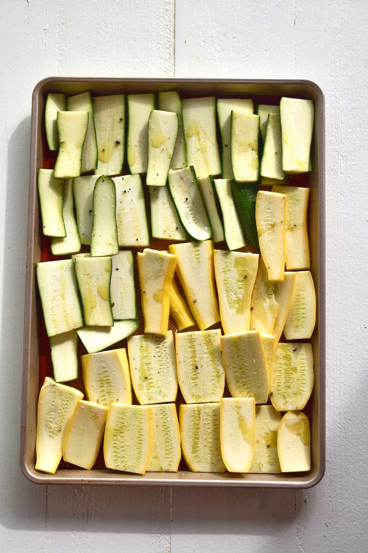 zucchini ready to roast in a pan