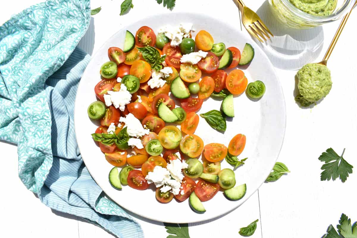 overhead shot of tomato, cucumber and avocado salad