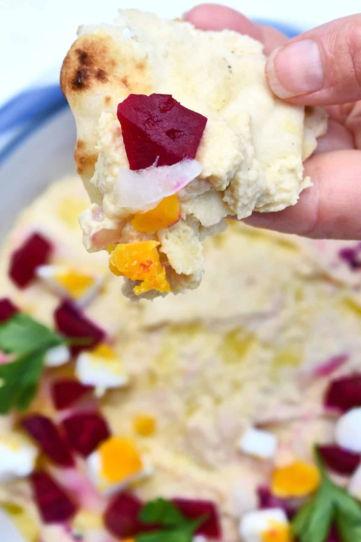 pitta bread with Warm Hummus with Roasted Pickled Beets, Onions, and Egg