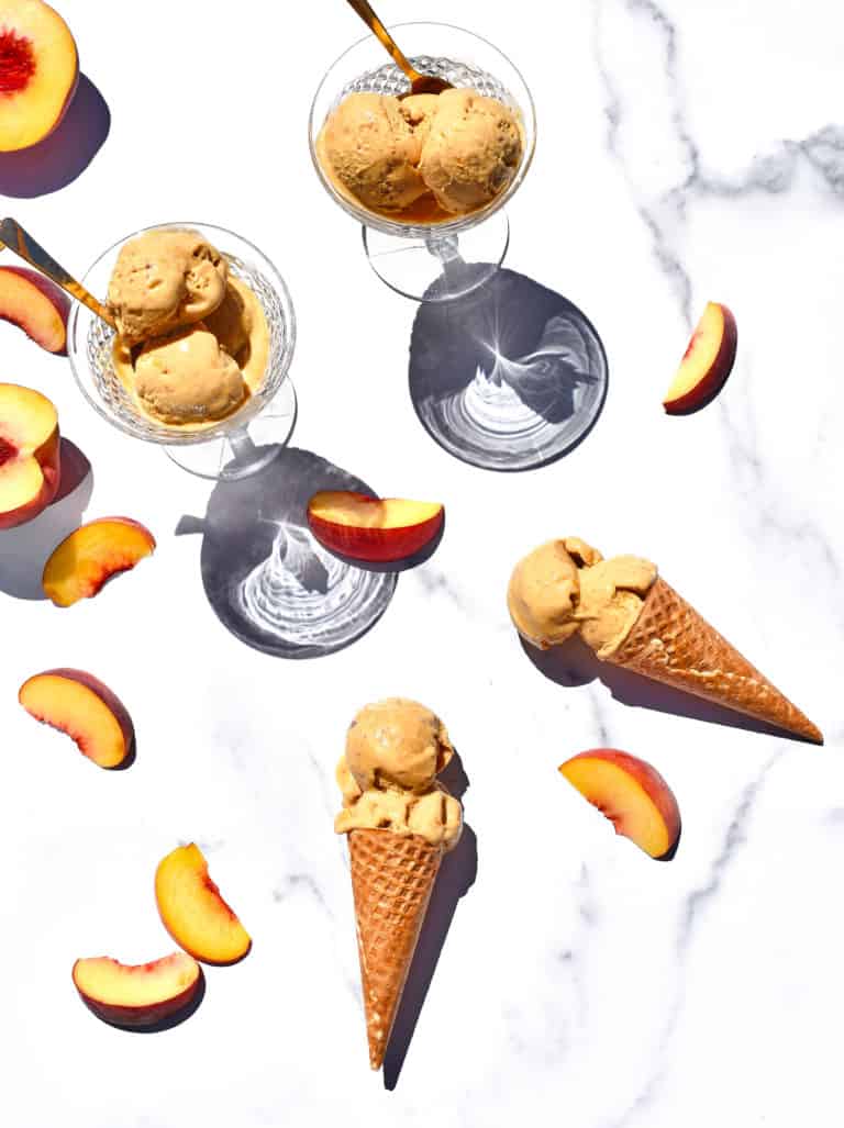 overhead shot of waffle cones filled with peach ice cream