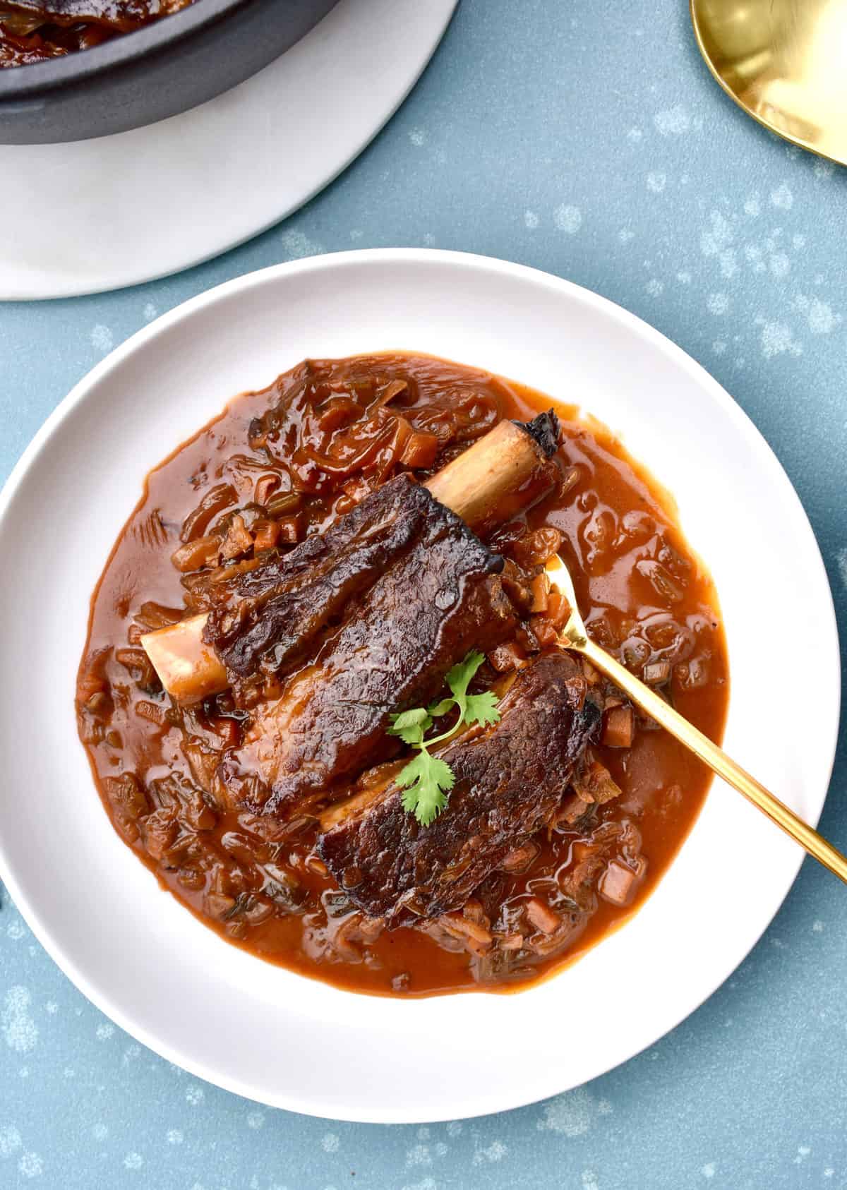 Korean braised beef in a bowl with a spoon ready to eat