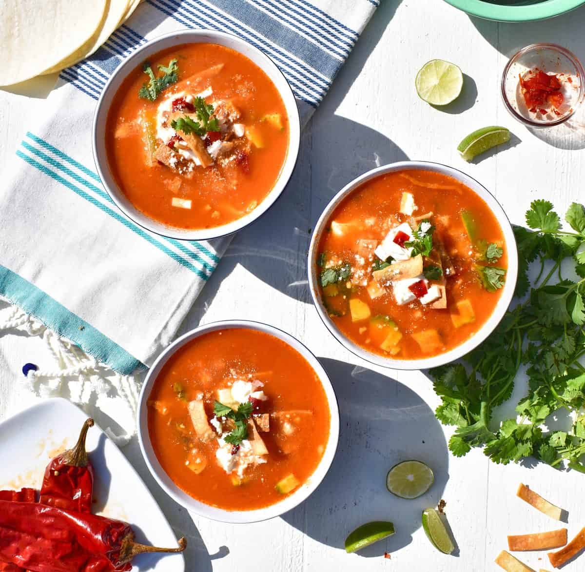 Three bowls of chicken tortilla soup