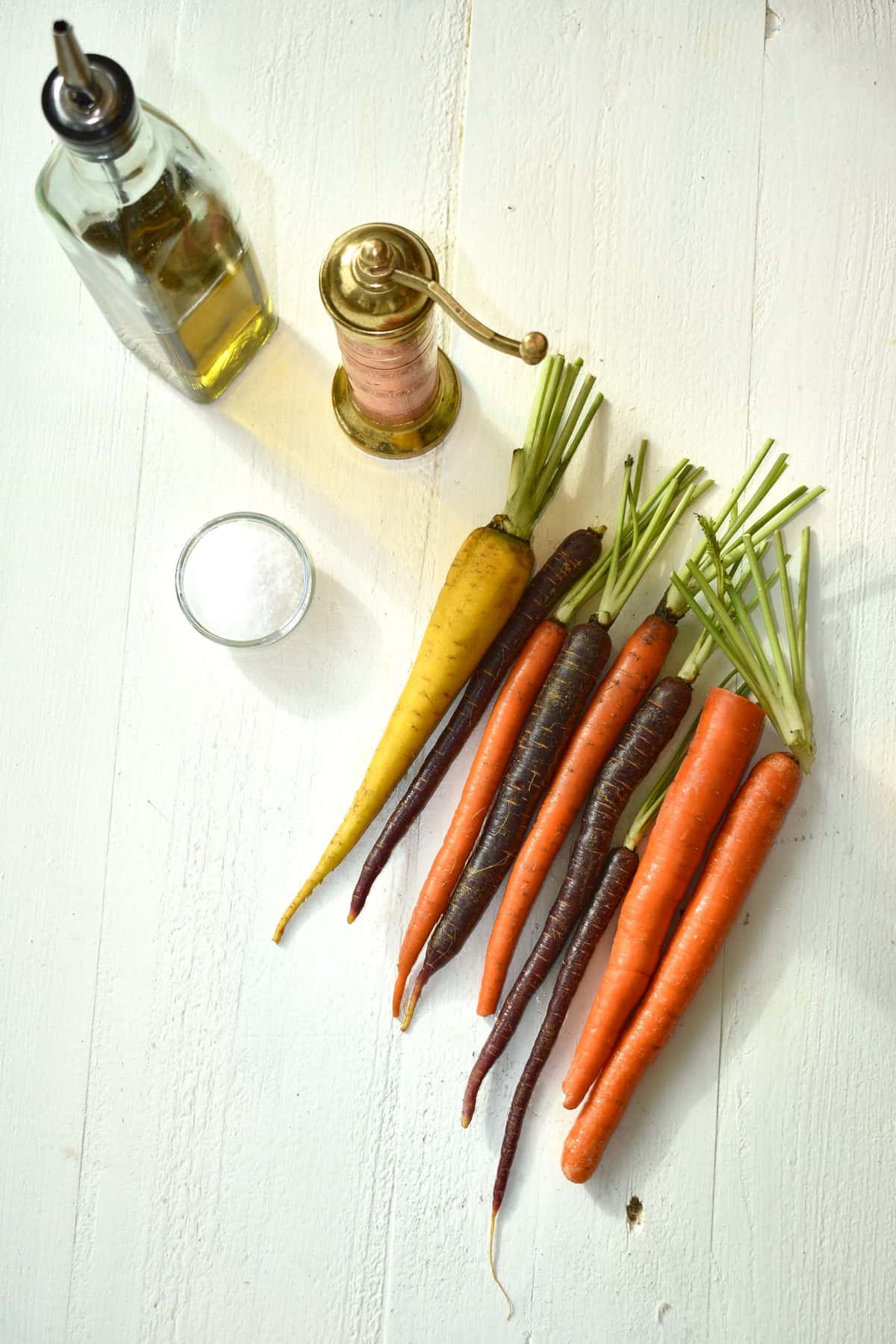 yellow, purple and orange carrots, salt, oil and pepper