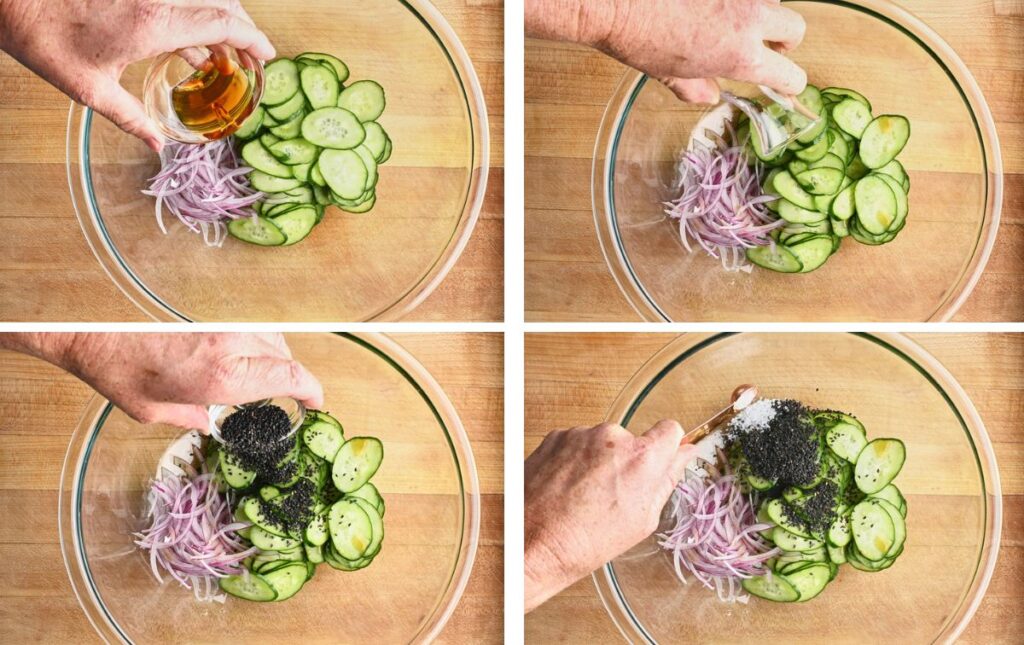 Adding sesame oil, rice vinegar, black sesame seeds, and salt to thinly sliced cucumber and onion for Japanese cucumber salad.