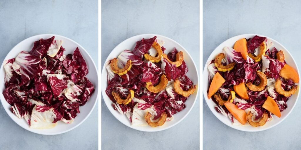 Torn radicchio layered with roasted delicata squash and sliced persimmons in a white bowl.