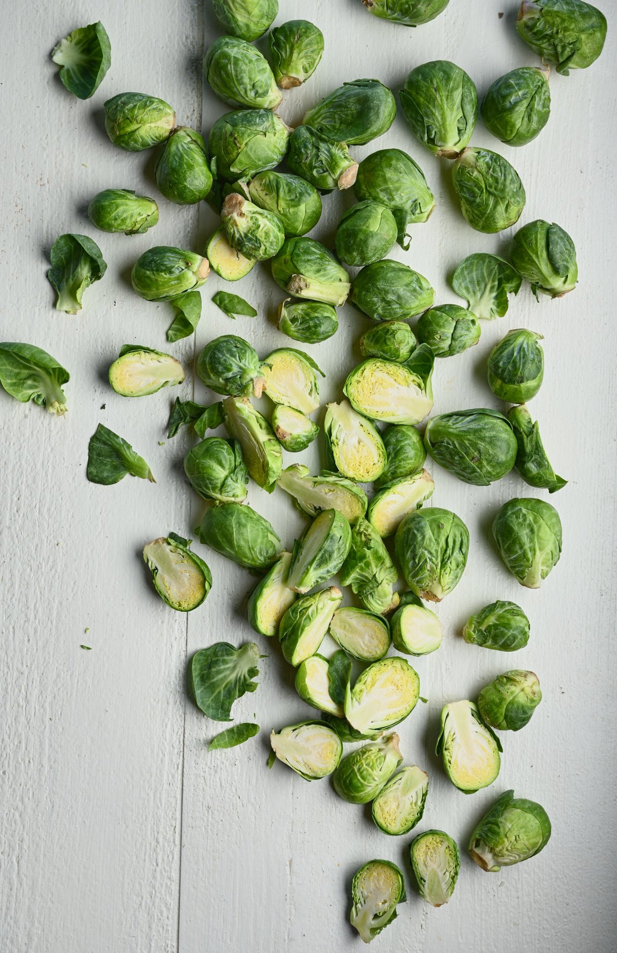 Brussel Sprouts spread about a white table