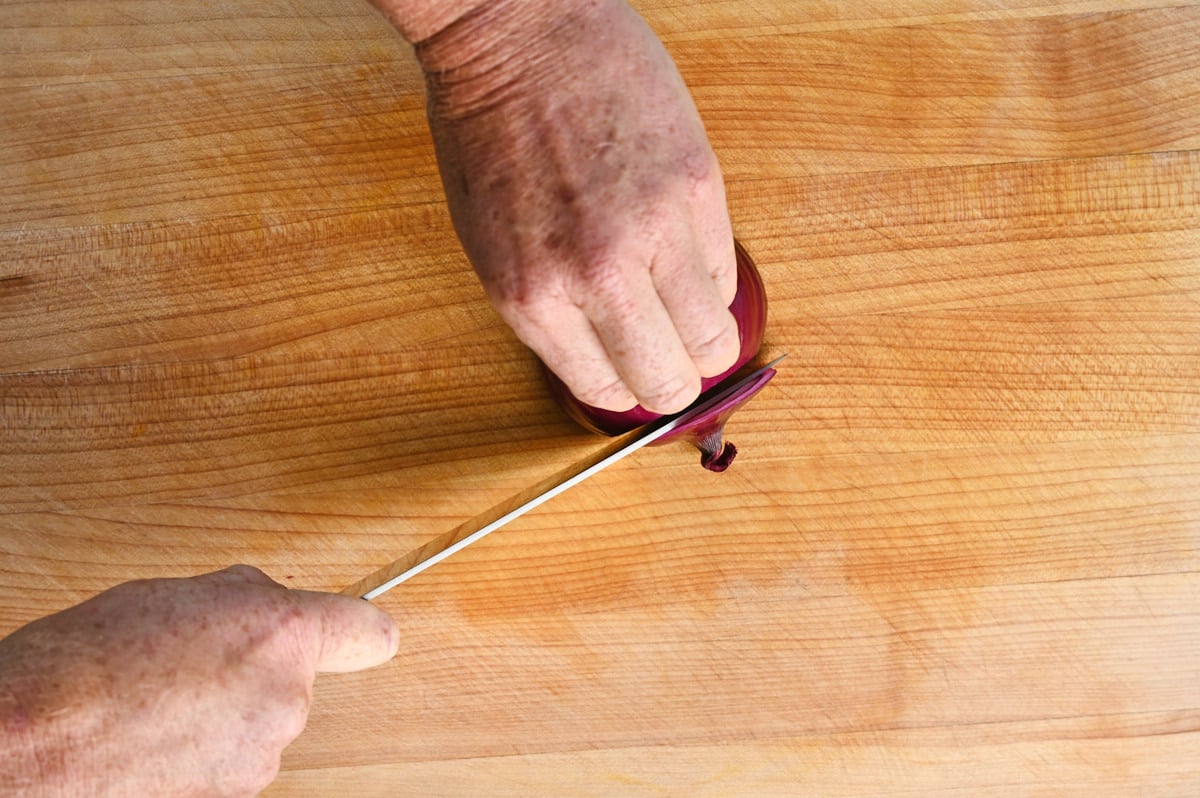 a red onion being cut