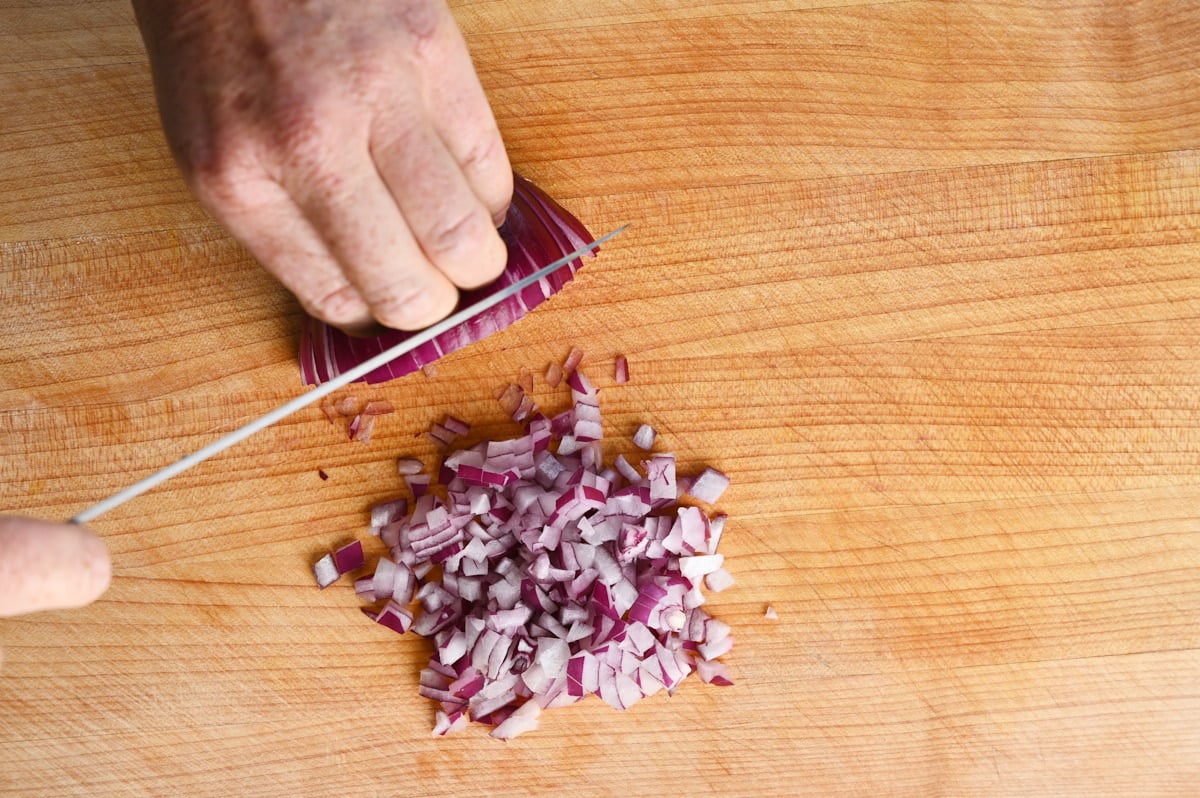 red onion being diced