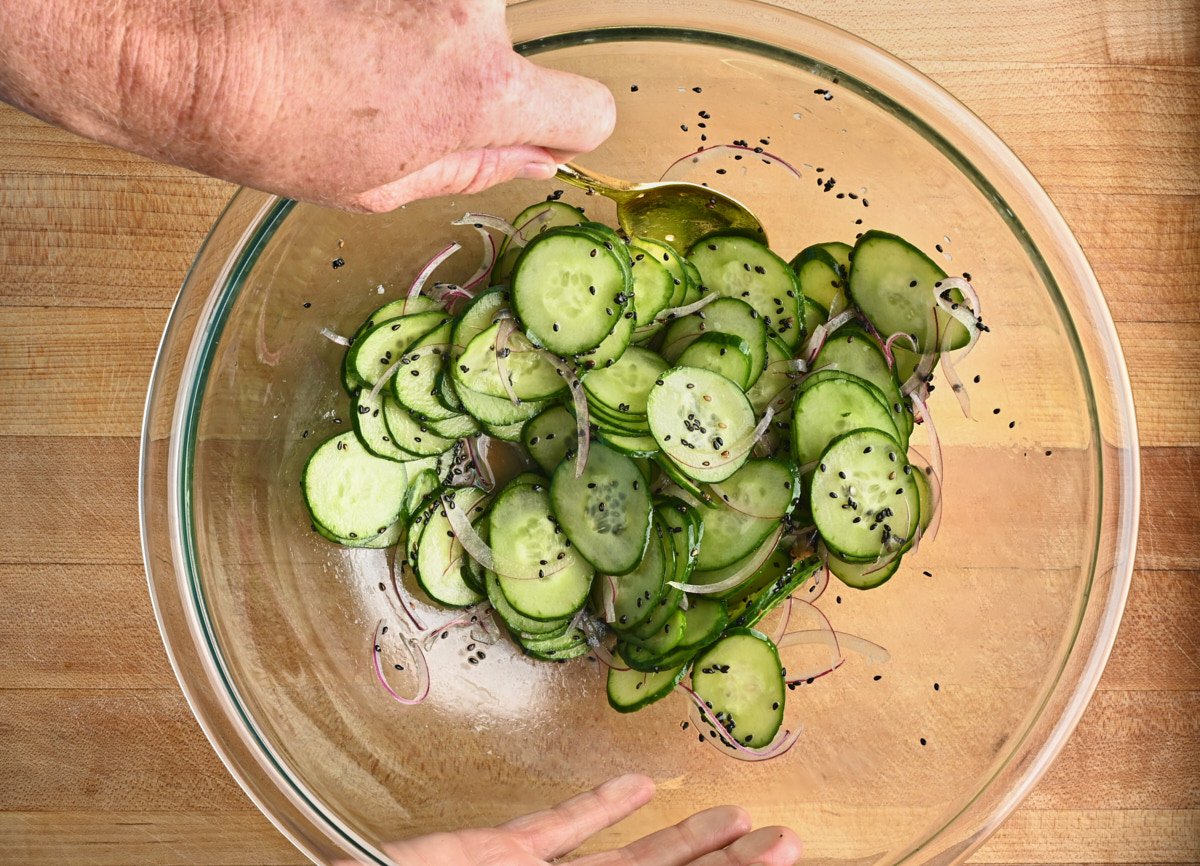 cucumber salad in a glass bowl. 