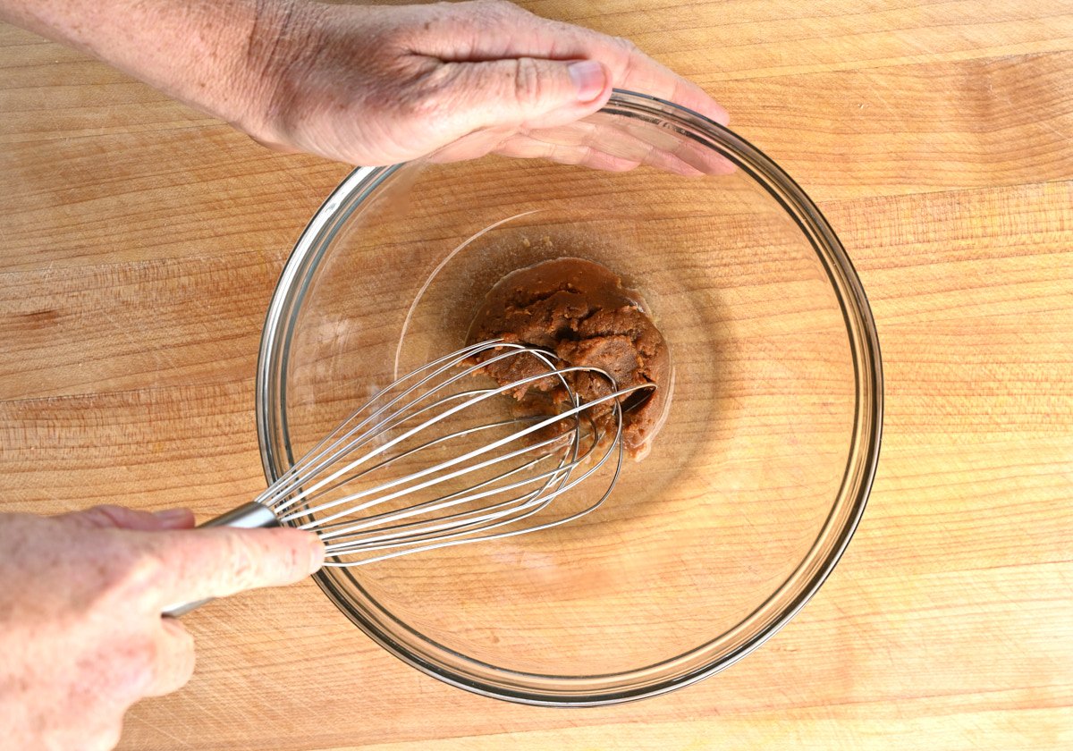 whisking miso paste and water