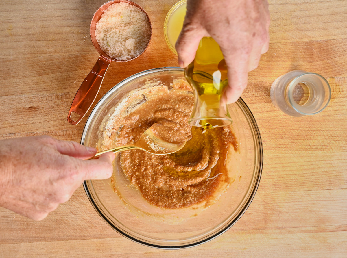 Olive oil being added to the miso sauce