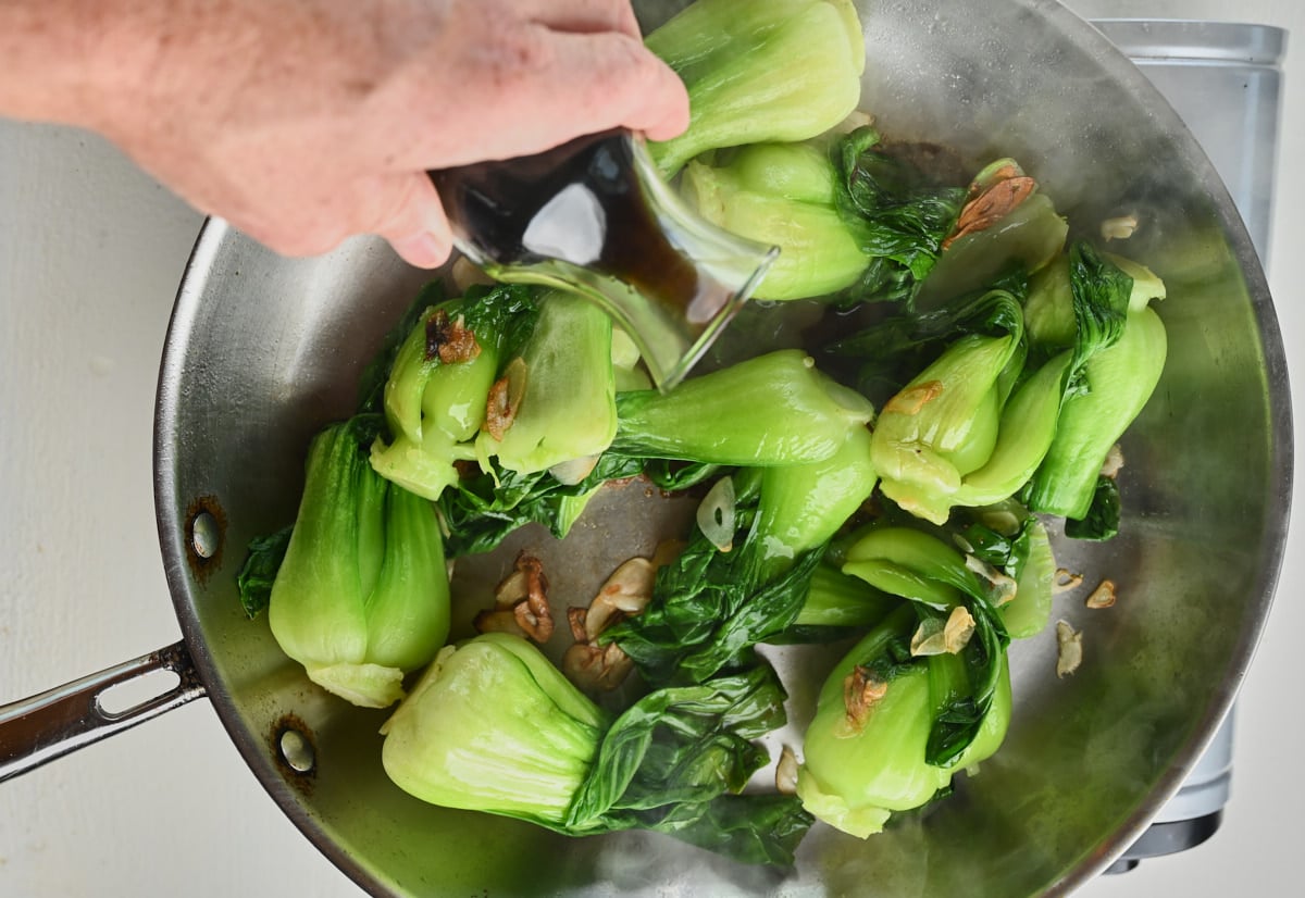 Sauteing baby bok choy and garlic and soy sauce