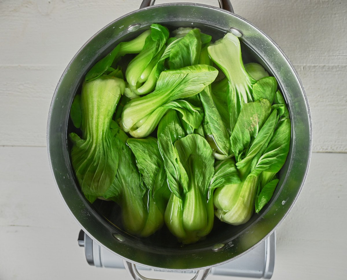 baby bok choy in a pot blanched