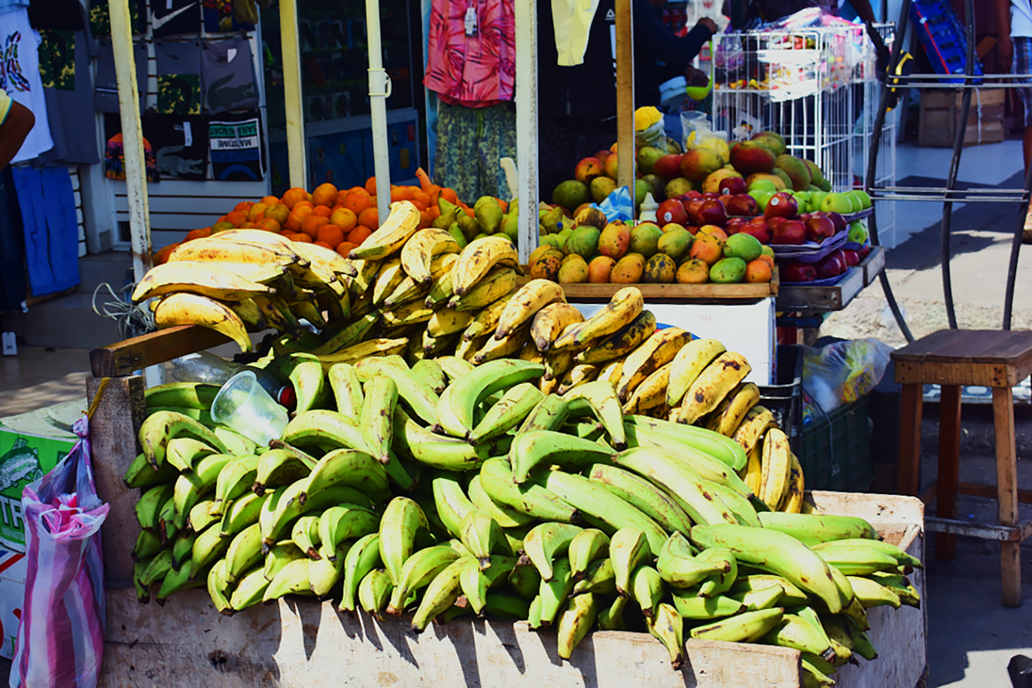 stacked plantains and fruit in the market