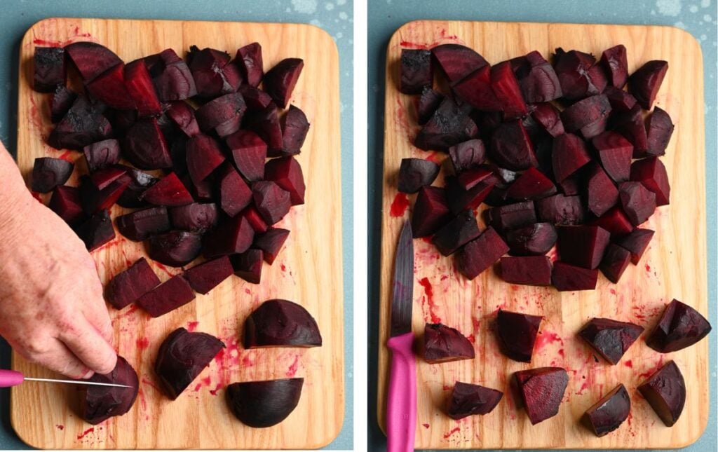 Hands slicing roasted beets into quarters and wedges on a wooden cutting board, showcasing their rich red color.