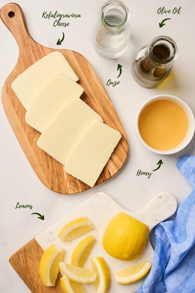 Ingredients for saganaki including Kefalograviera cheese, olive oil, ouzo, lemon, and honey