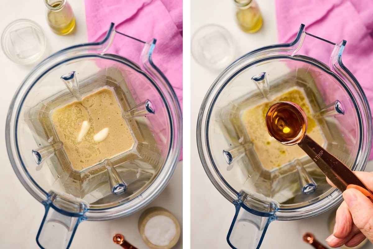 Maple syrup being poured into blender with other tahini dressing ingredients