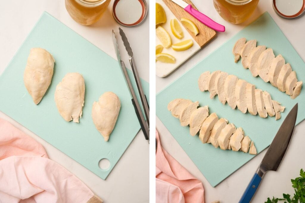 Poached chicken breasts resting and sliced on a wooden cutting board