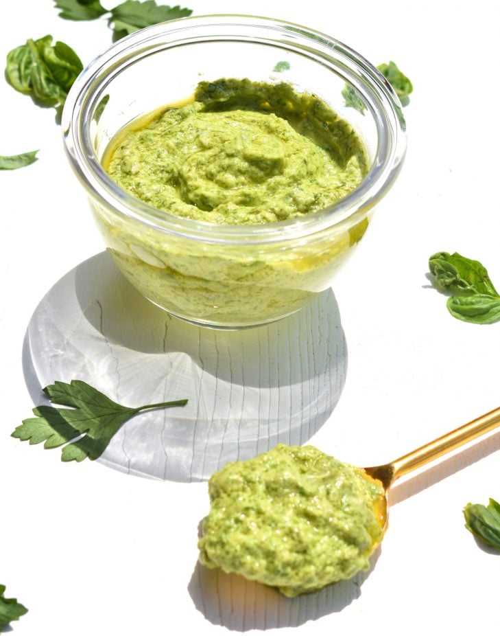 Green Goddess Dressing in a bowl with a spoon